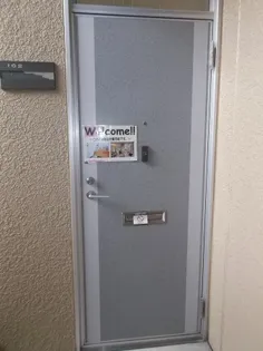 プレジール三宅 C【1階】の玄関