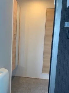 サニープレイス志布志 A棟【2階】の玄関