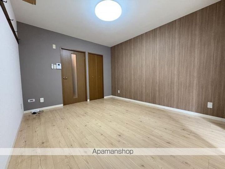 ベルメゾン松福102の居間