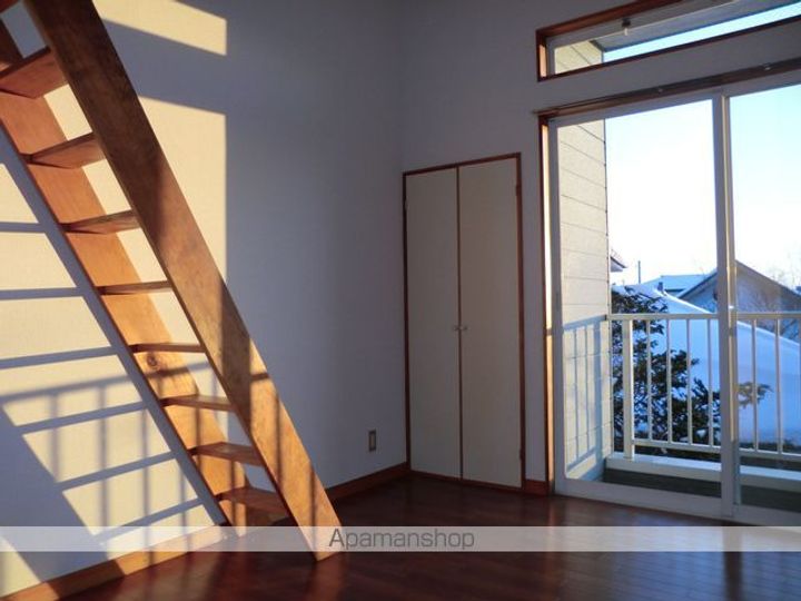 グリンピュア古川A棟103の居間