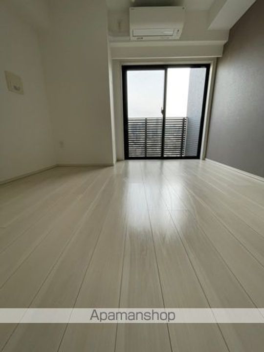 東京都中野区弥生町5丁目の賃貸マンションの居間