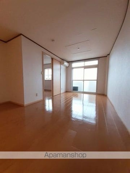 長野県松本市大字原の賃貸アパート203の居間