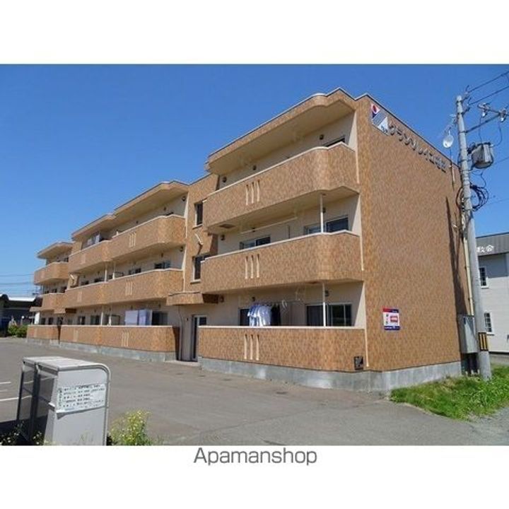 グランソレイユ屯田203の外観