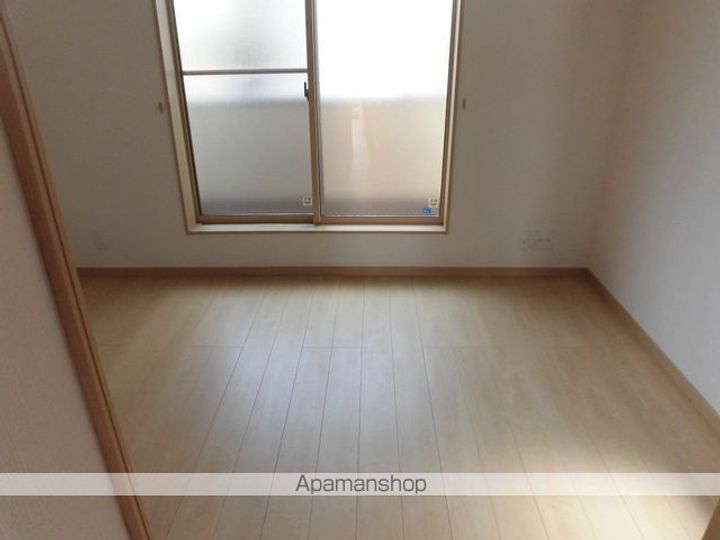 ブルースカイハイツ鎌田106の居間