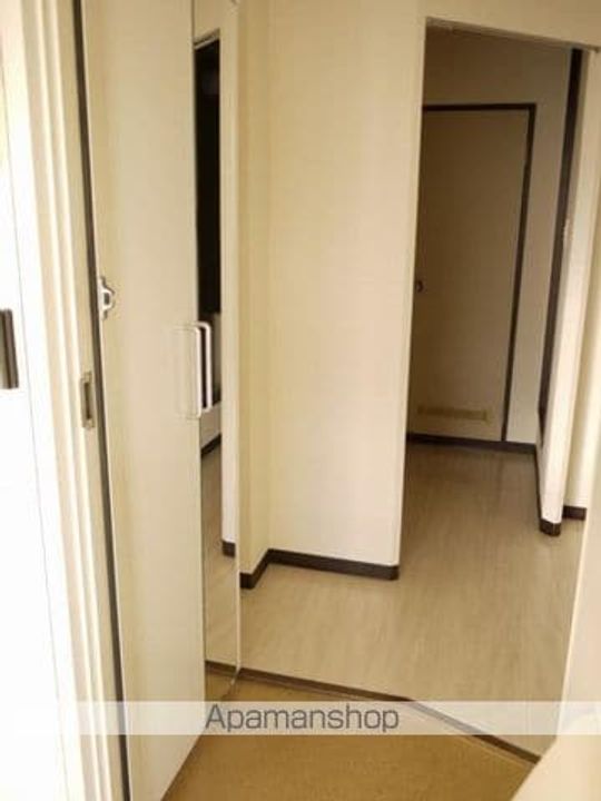 フレグランスクイーンテットA棟202の玄関