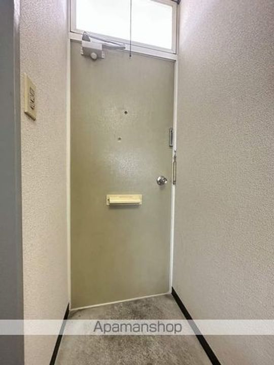 コスモハウス旭ヶ丘302の玄関