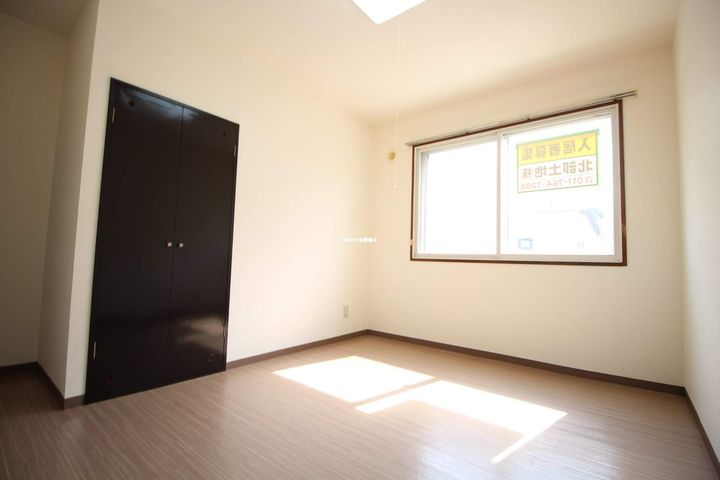 北海道札幌市北区新琴似十一条8丁目の賃貸マンションの居間