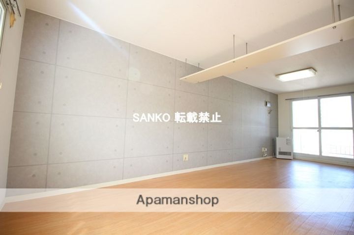 北海道札幌市北区北三十二条西6丁目の賃貸マンションの居間