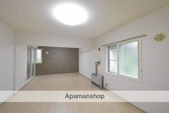 北海道札幌市豊平区美園十条7丁目の賃貸マンションの居間