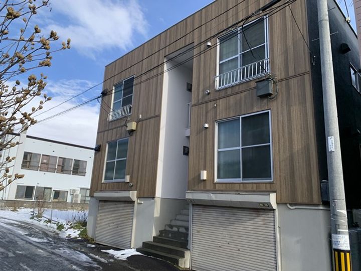 H&M川沿203の外観