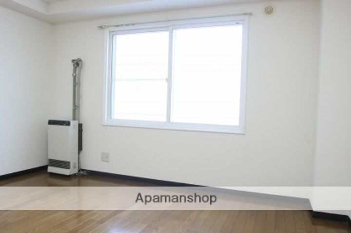 北海道札幌市南区澄川二条4丁目の賃貸マンションの居間