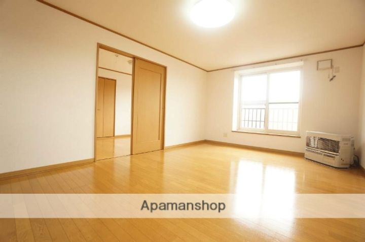 北海道石狩市花川南一条2丁目の賃貸アパートの居間