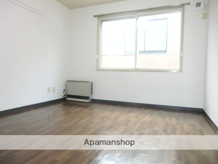 北海道札幌市北区北十五条西3丁目の賃貸マンションの居間