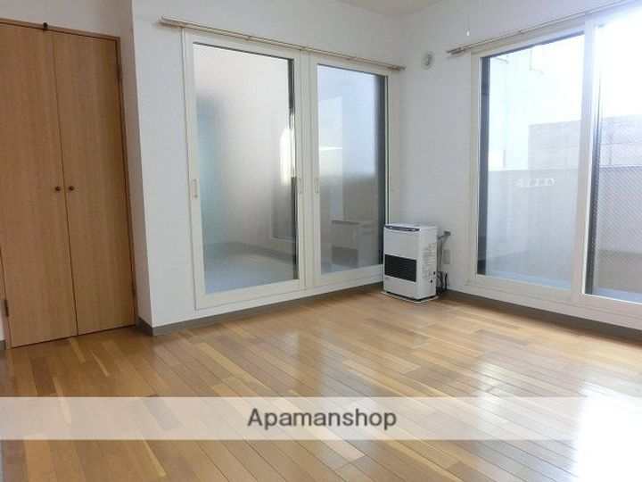 北海道札幌市西区山の手三条6丁目の賃貸マンションの居間