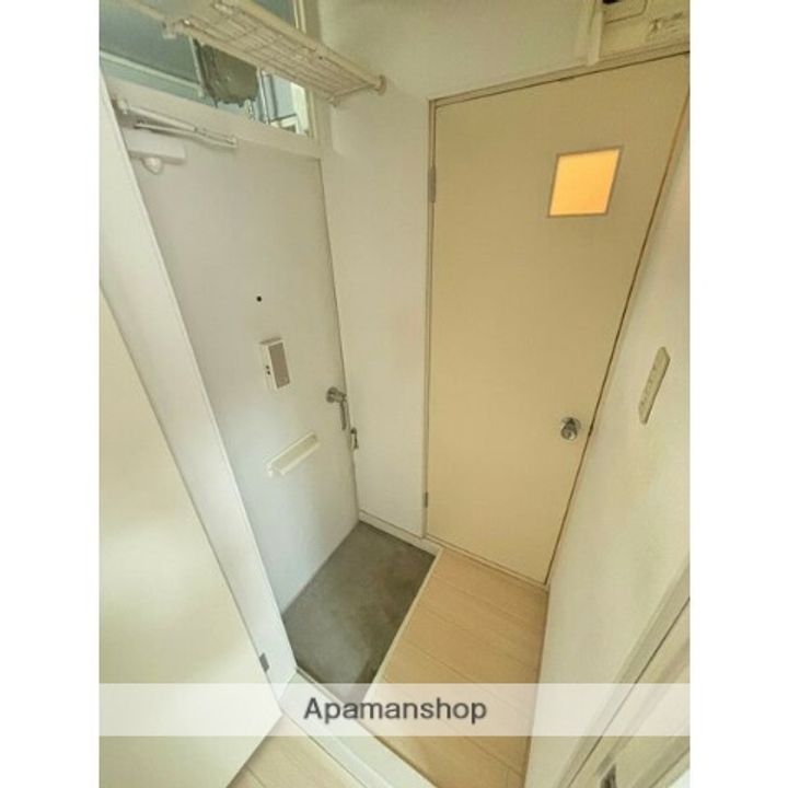 ノースパーク麻生204の玄関