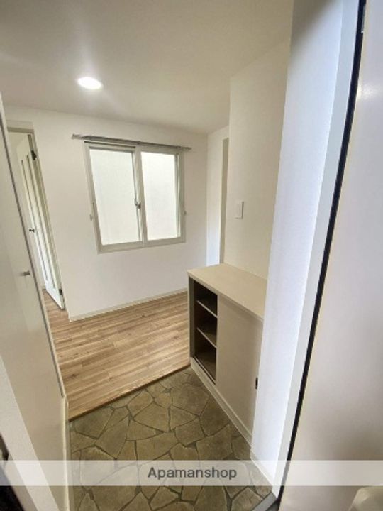 メゾンドルチェ十八番館103の玄関