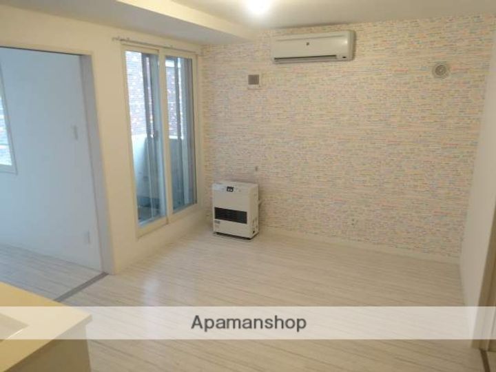 北海道札幌市中央区南五条西9丁目の賃貸マンションの居間