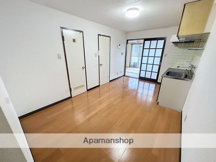 明保野レジデンス305の居間