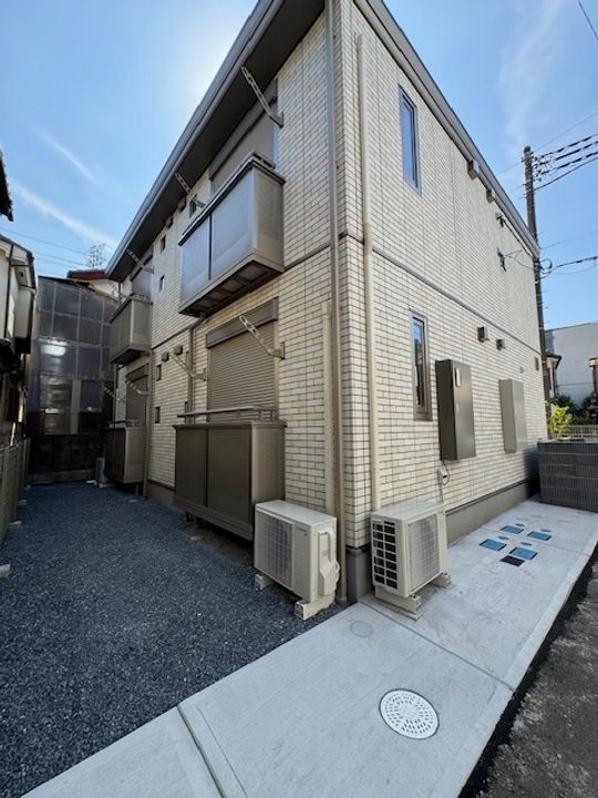 ベルサイズフラット鶴瀬201号室の外観