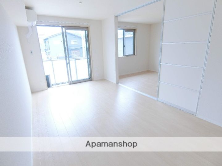 京都府木津川市城山台11丁目の賃貸アパート203の居間