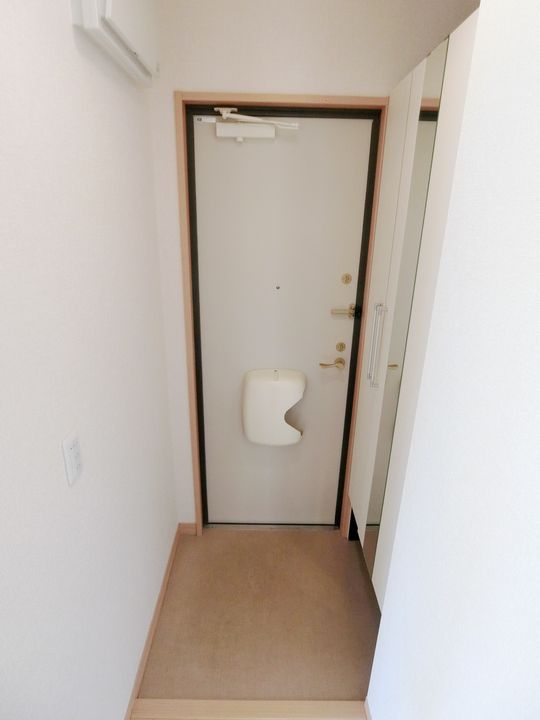 リビングタウン州見台 D棟の玄関