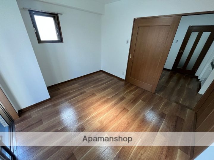 大阪府大阪市都島区高倉町1丁目の賃貸マンションの居間