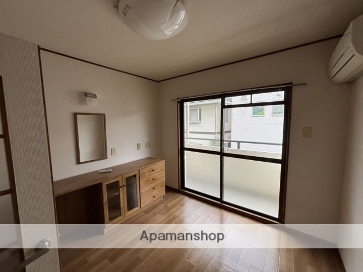 広島県広島市安佐南区長束3丁目の賃貸マンションの居間