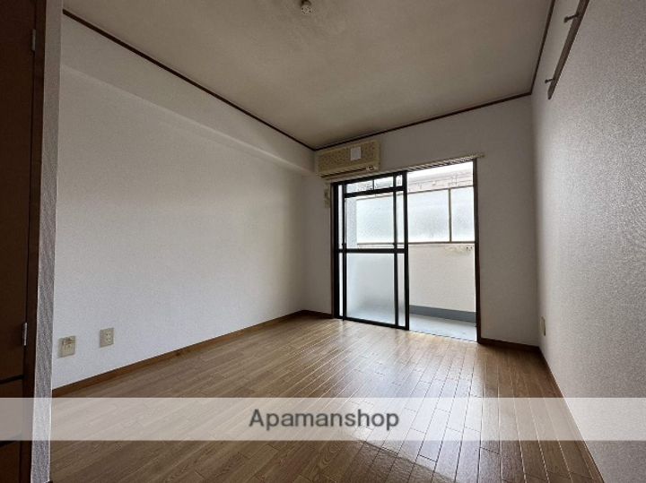 広島県広島市西区楠木町1丁目の賃貸マンションの居間