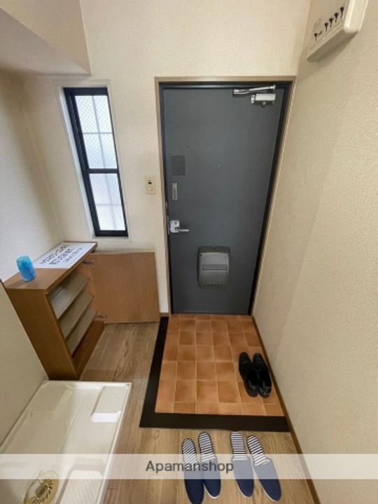 メゾン・ド・ブラン旭202の玄関