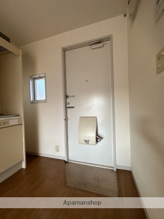 サン・グランデ2号棟101の玄関