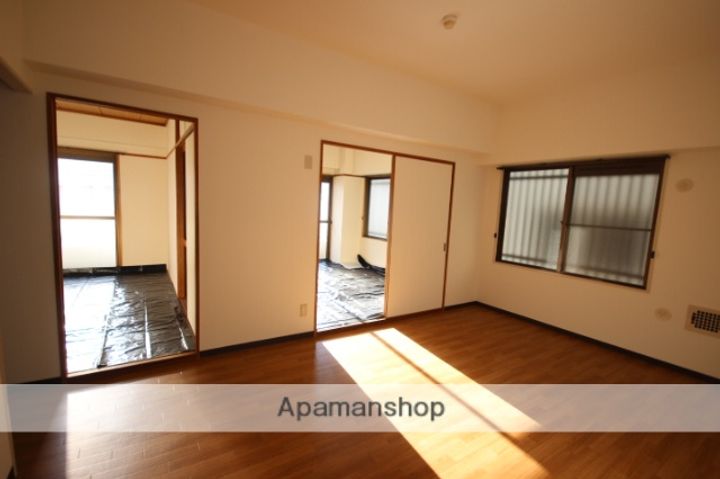 広島県広島市西区庚午北2丁目の賃貸マンションの居間