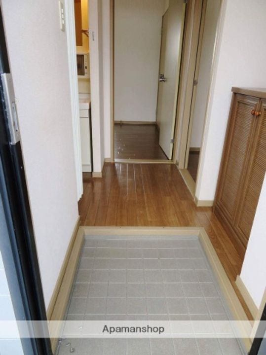 サンガーデンあすなろC202の玄関
