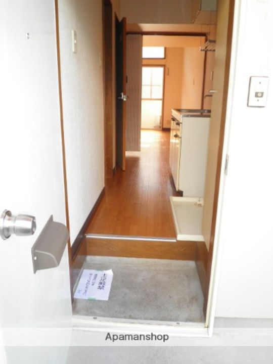 メイプルコート一万城 A・B・C棟C103の玄関