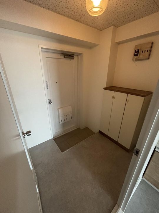 エスカイア麻生の玄関