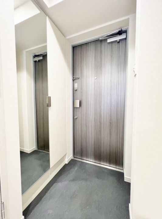 プレサンス東三国駅前グランクラスの玄関