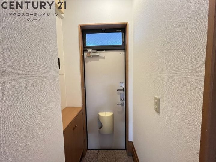 プチメゾンKMの玄関