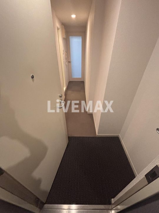 オーパスホームズ三田の玄関