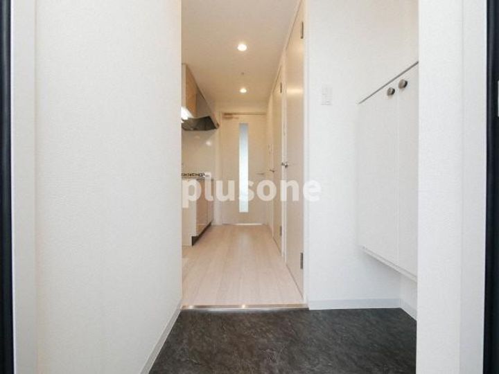 フォーリアライズ弁天町クロスの玄関