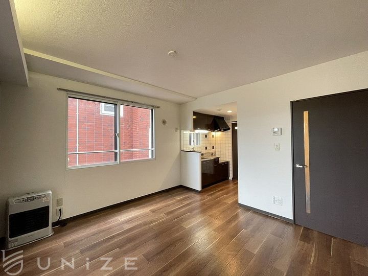 北海道札幌市豊平区平岸四条4(マンション)の賃貸物件の居間