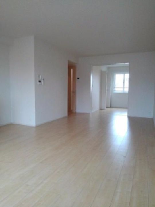 Mメゾン東開の居間