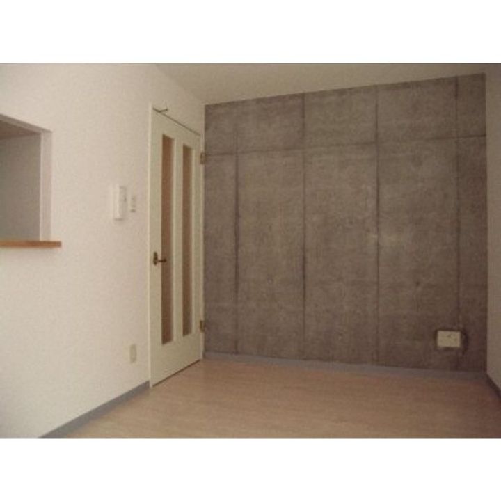 北海道札幌市中央区南九条西12の賃貸マンションの居間