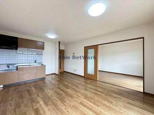 愛知県豊川市本野町西野添(マンション)の賃貸物件305の居間