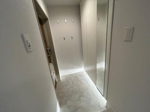 コープ野村東桜の玄関