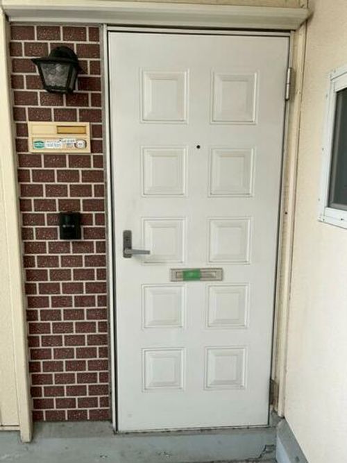 河原サンハイツB106の玄関