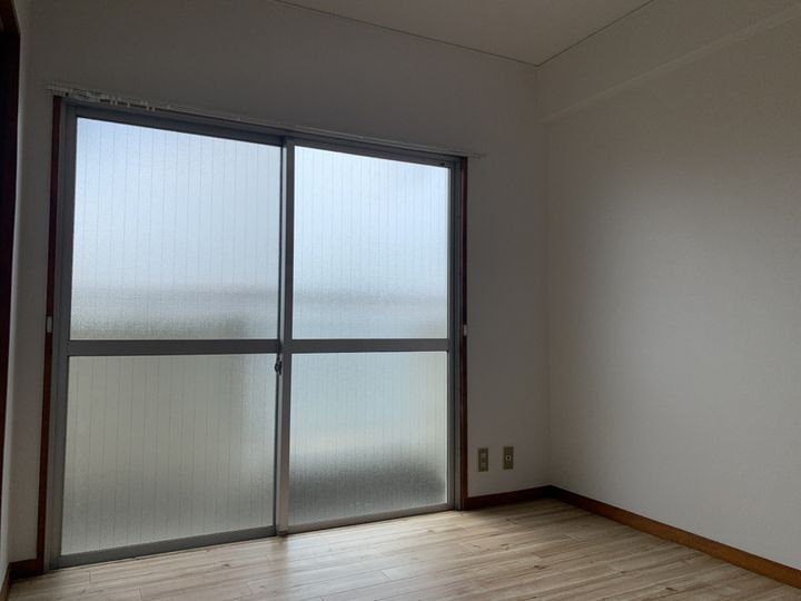 マンションまるか302の寝室