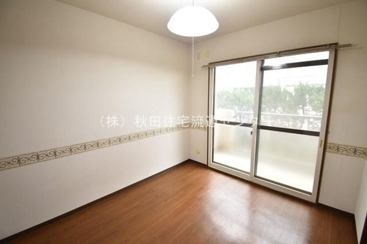 メゾン・ド・ノア飯島104の寝室