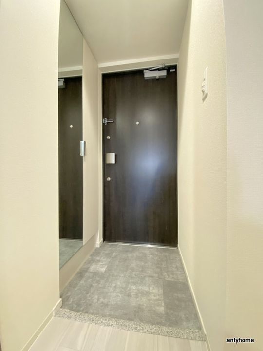 プレサンス塚本アクミリオンの玄関