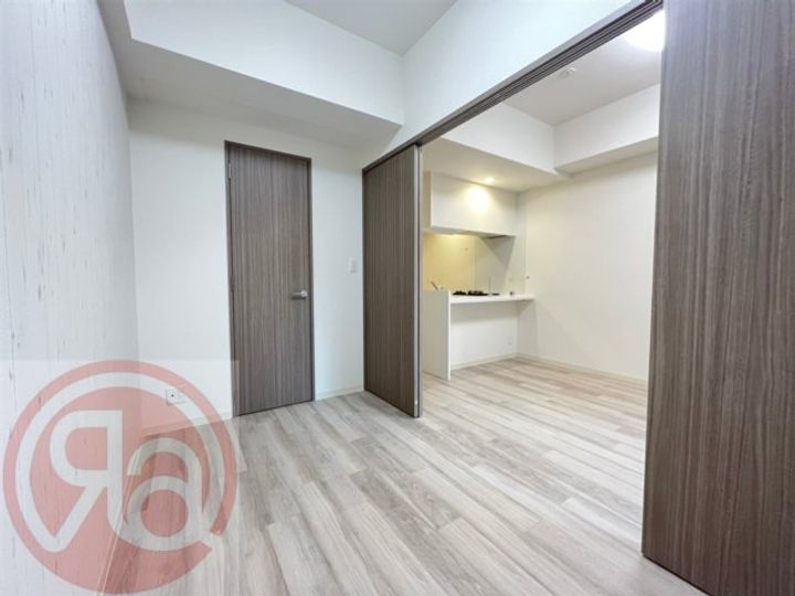 プレサンスDOMECITYコレーレの寝室