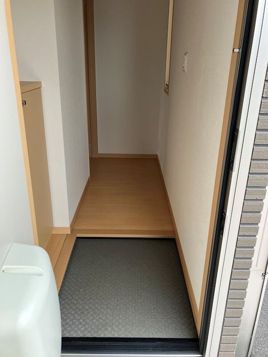 コンフォールKⅡ A棟102の玄関