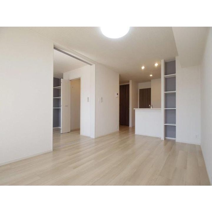 コンフォーティア小諸 C棟103の居間